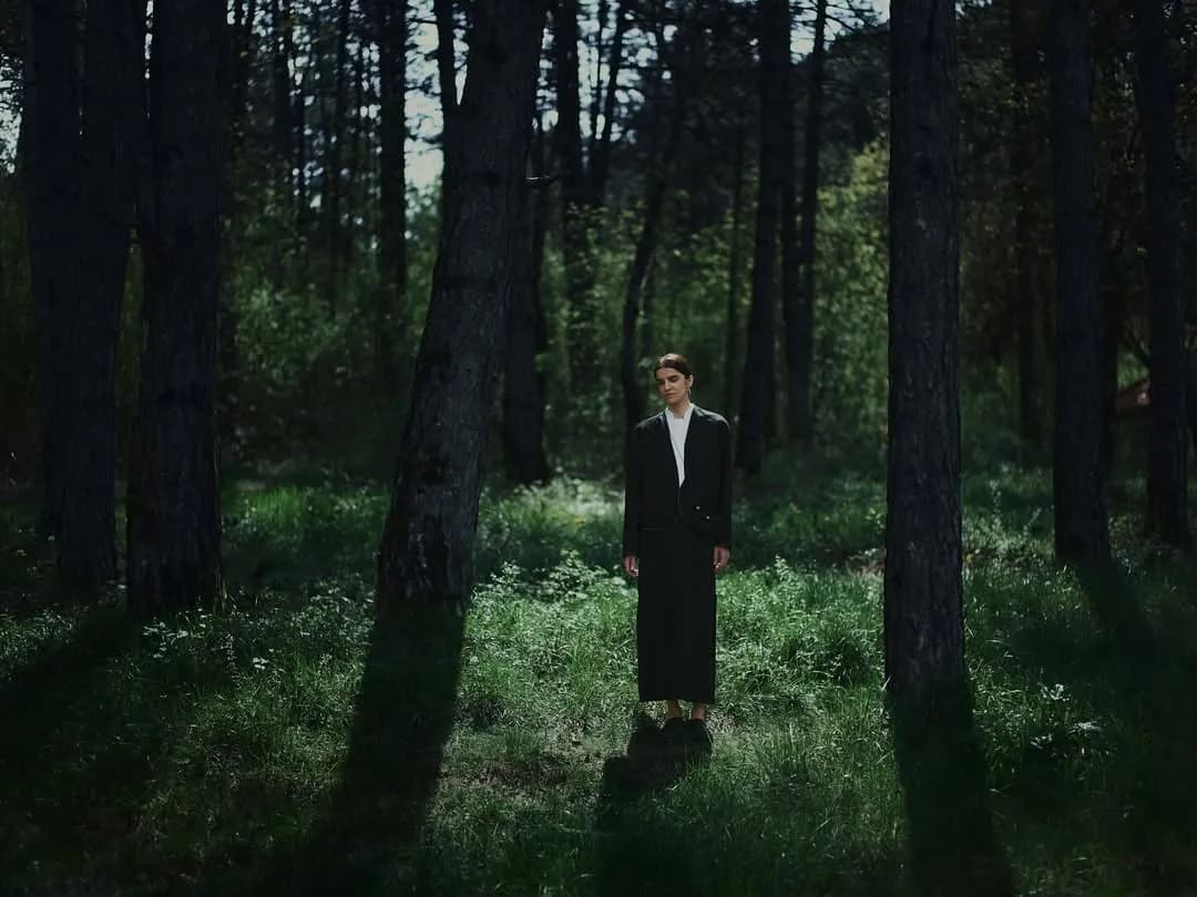 A Kokoro silhouette among the pines